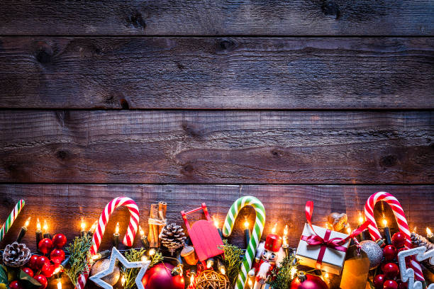 istock Christmas ornaments background on rustic wooden table 1070550016