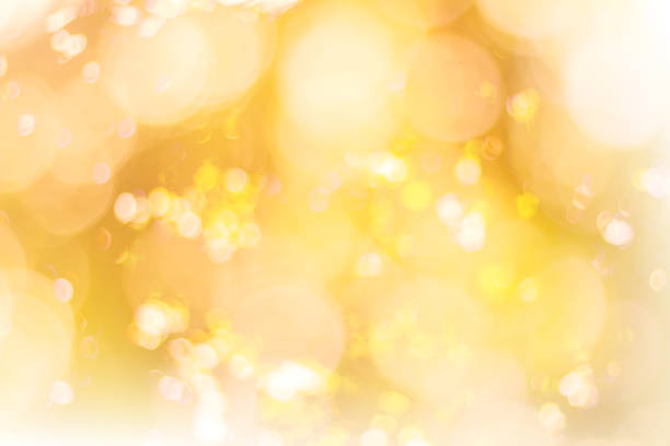 istock Abstract glamorous white silver and gold bokeh lights glitter sparkle. Defocused background have luxury golden color party invite for birthday, anniversary, holliday, new yearâs eve or Christmas. 1070551658