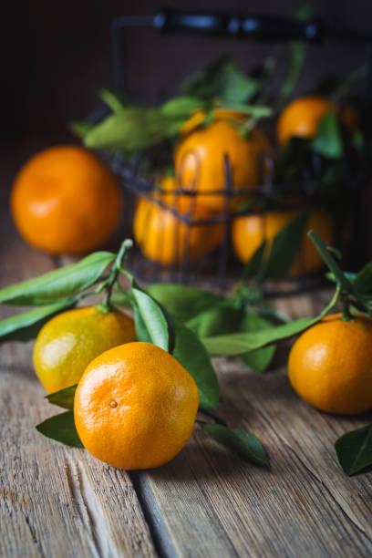 istock Tangerines with green leaves. 1070563338