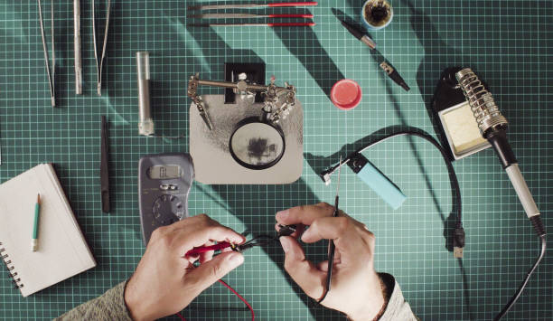 istock Repairing of a wire for electronic devices. 1070563724