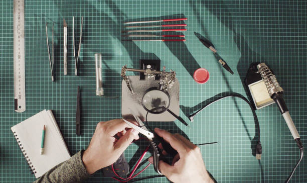istock Hands of a man cutting a wire 1070563736