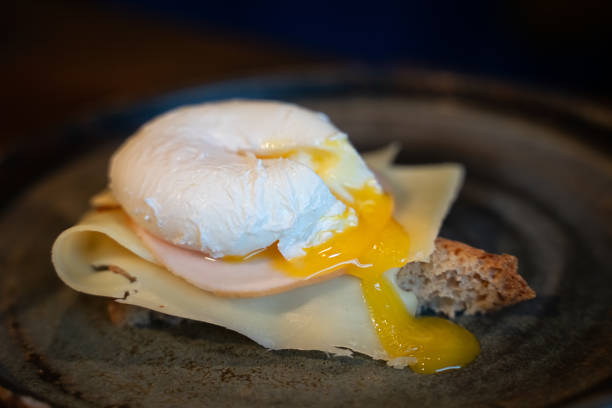 istock Whole wheat toasted bread with cheese, ham and poached egg 1070565894