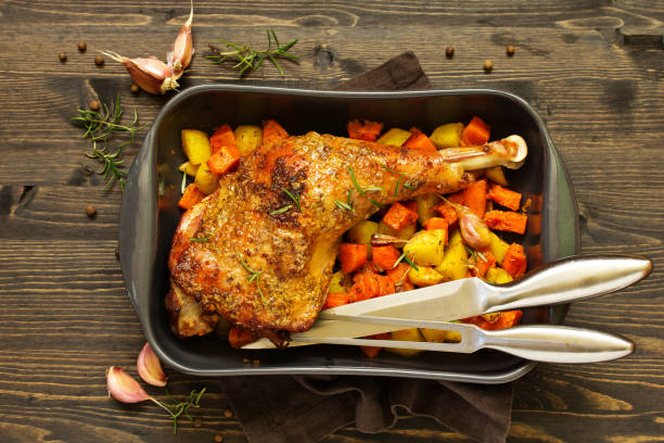 istock baked turkey thigh with vegetables. 1070571440
