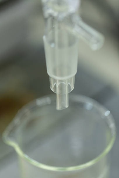 istock The study Separating by filtration and evaporation condensation the component substances from liquid mixture in Lab. 1070576410