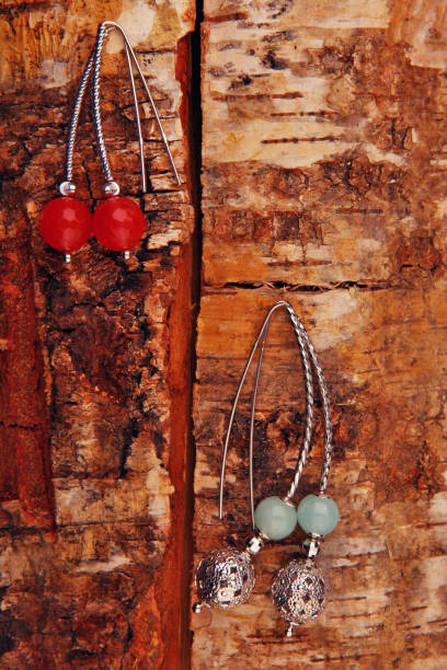 istock agate stone silver earrings wooden background 1070576592