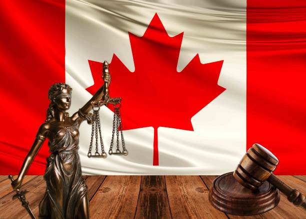 istock statue of justice with hammer and canada flag 1070580400