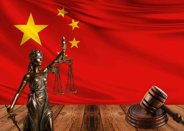 istock statue of justice with hammer and china flag 1070580460