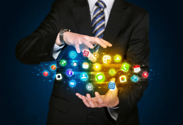 istock Businessman holding app icon cloud 1070582500