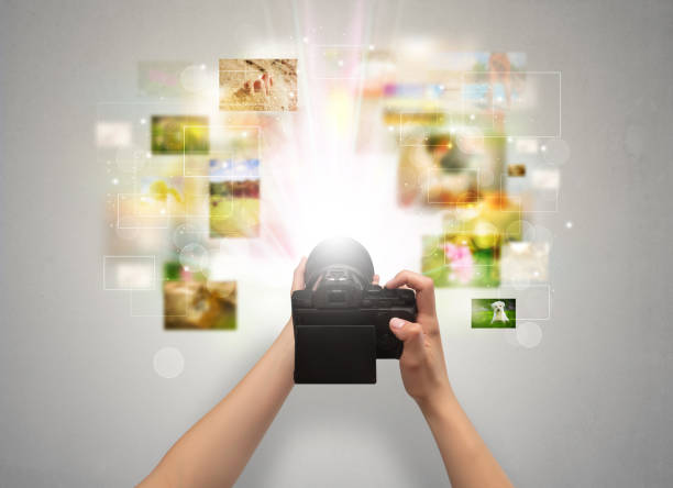 istock Hand captures life events with digital camera 1070589570