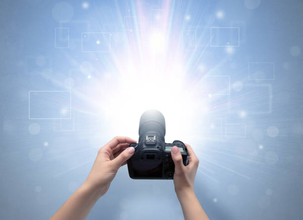 istock Hand taking photo with glowing flash concept 1070590188