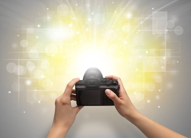 istock Hand taking photo with glowing flash concept 1070590444