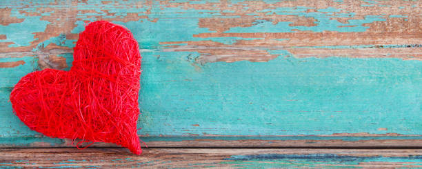 istock Red heart and wooden background 1070591488