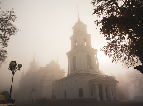 Old orthodox church in Poltava city, Ukraine in fog