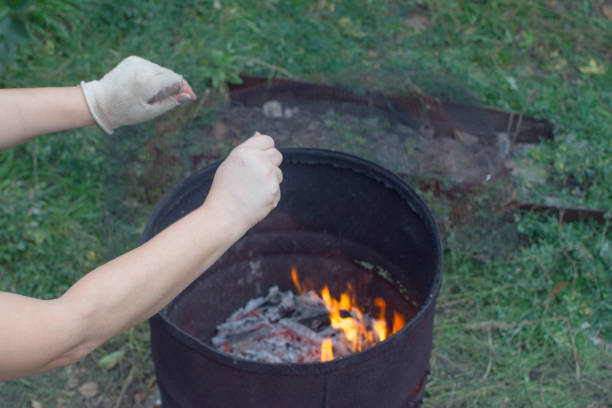 istock homeless people warm their hands 1070594776