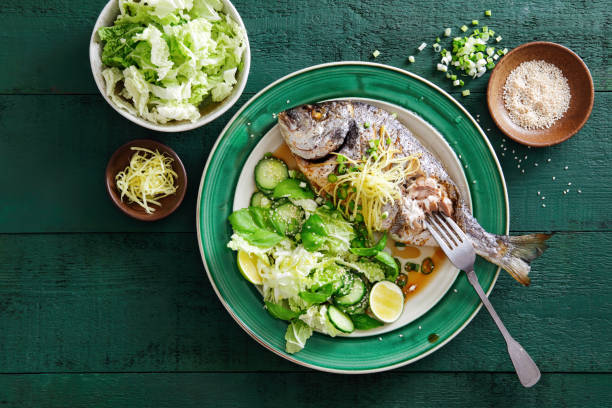 istock Grilled sea bream with vegetables, herbs, ginger, quinoa salad 1070595490