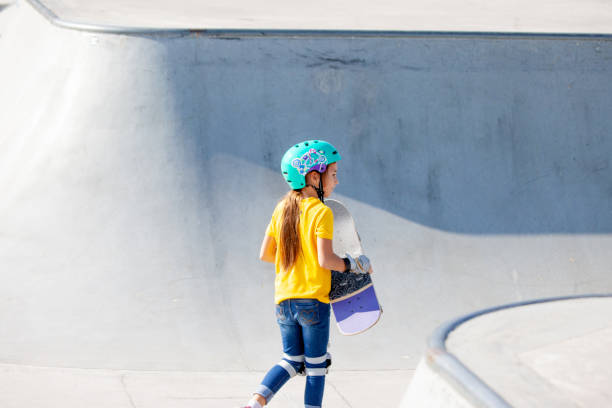 istock Young Skateboarding Girl in Skatepark 1070595510
