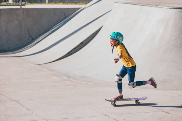 istock Young Girl Skateboarding in Skatepark 1070595662