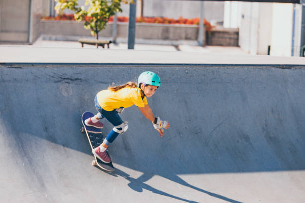 istock Young Skateboarding Girl Gaining Speed on Quarter Pipe 1070595664