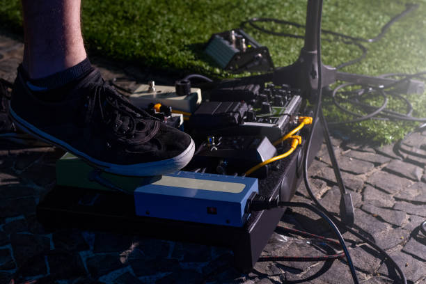 istock Guitar pedals with feet on show 1070596812