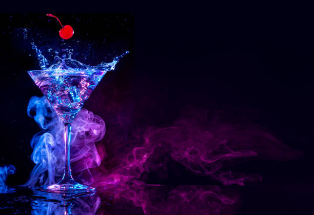 istock martini splashing in a colored smoky background 1070598430