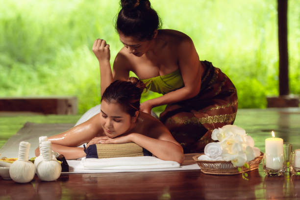 portrait of asian woman is relaxing in spa massage, thai massage - thai ethnicity massaging thailand thai culture imagens e fotografias de stock
