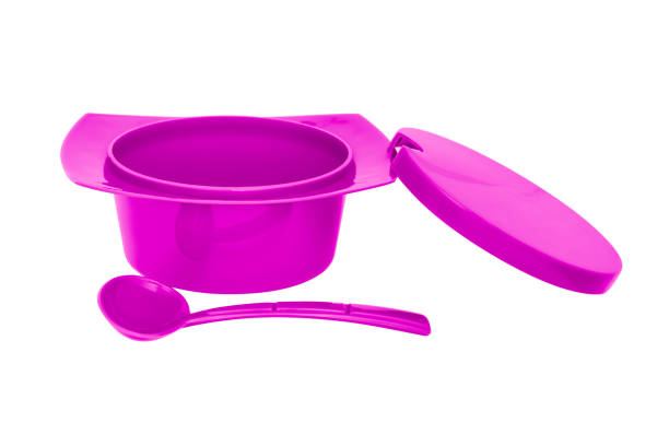 istock Color plastic sugar bowl with spoon on white background 1070604906