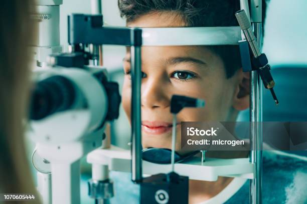 Eye Exam Ophthalmology Slit Lamp Exam School Boy Having His Eye Sight Checked Stock Photo - Download Image Now