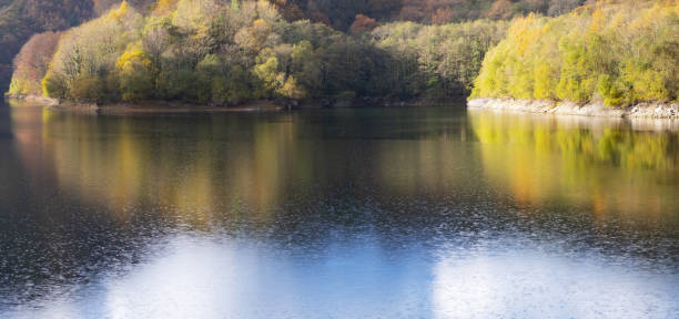 istock The forest in autumn is reflected in the Endara reservoir, Navarra 1070605916