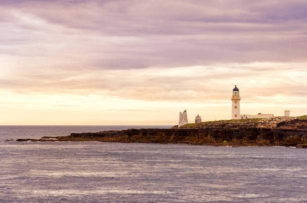 istock View with lighthouse over Orkney Islands 1070606966