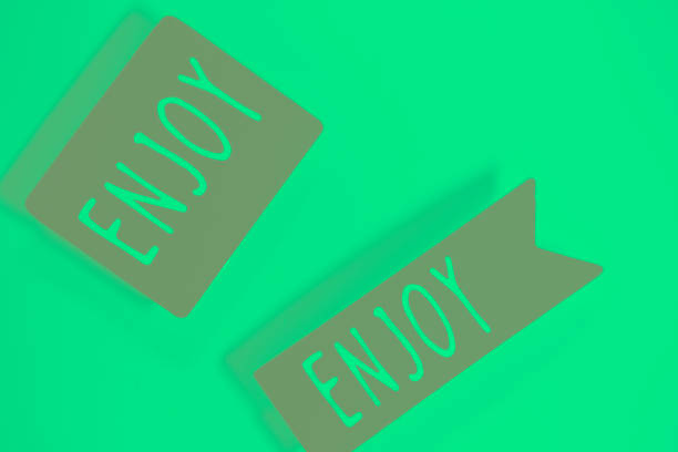 Enjoy greetings message written in letters on present tag.