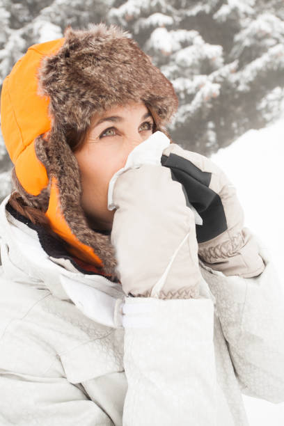 istock woman sniffing in the snow 1070617582