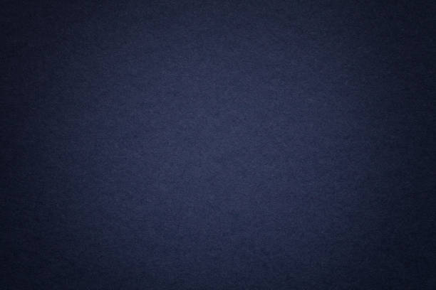 istock Texture of old navy blue paper background, closeup. Structure of dense cardboard. 1070618802