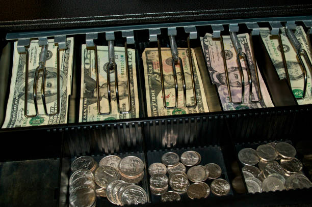 istock US dollars and coins in open cash drawer 1070620688