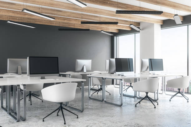 istock Concrete coworking office with empty laptop 1070629436