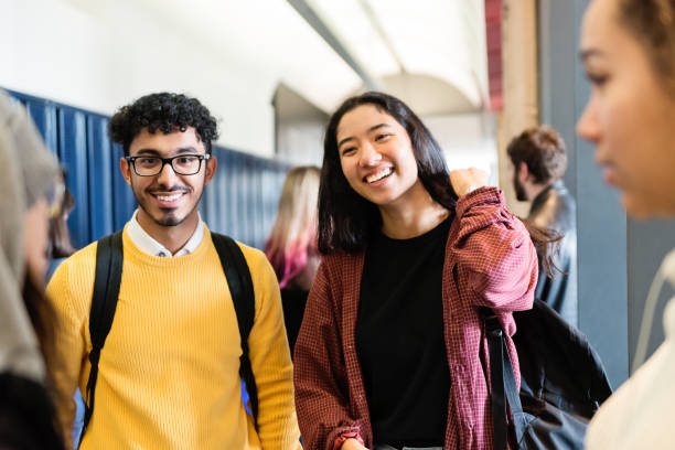 istock Multi-ethnic group of students hanging in College hall. 1070636018