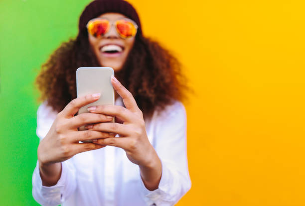 istock Curly haired african girl taking a selfie 1070639098
