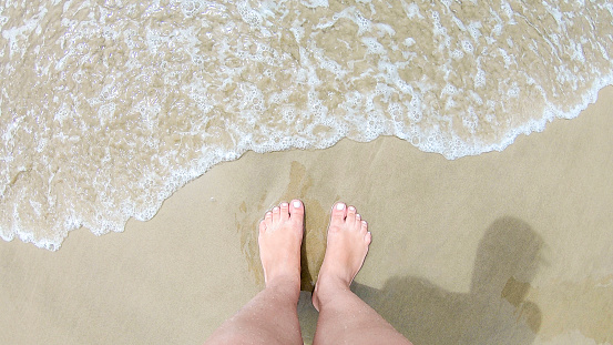 foot on the beach