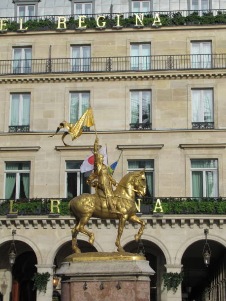 Joan of Arc Jeanne d'Arc is an 1874 French gilded bronze equestrian sculpture of Joan of Arc by Emmanuel Frémiet. The outdoor statue is prominently displayed in the Place des Pyramides in Paris. place des pyramides stock pictures, royalty-free photos & images