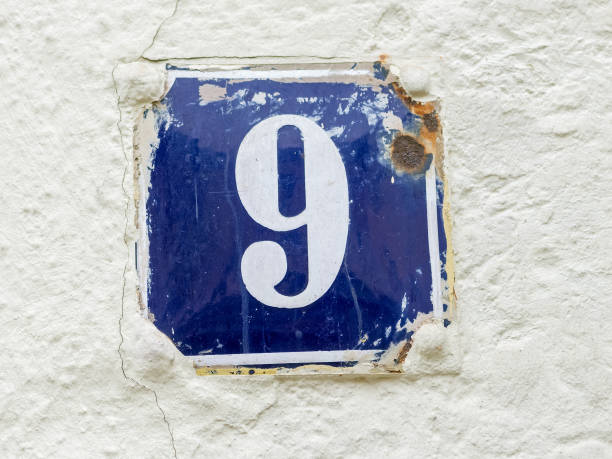 istock Old-fashioned enamel sign with house number 9 1070651184