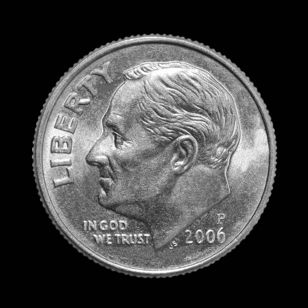 istock American one dime coin (10 cents) isolated on black background 1070654366
