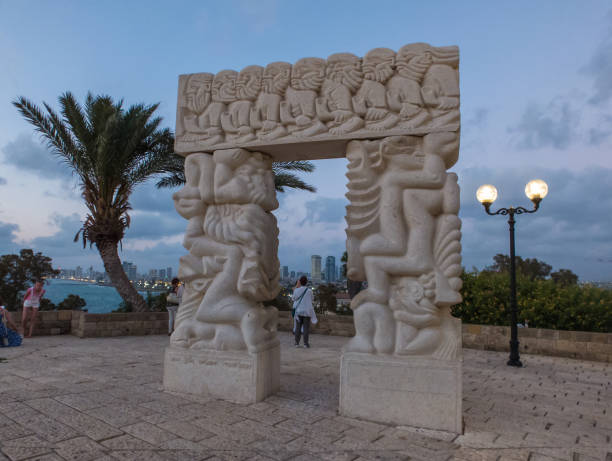 The Gate of Faith in Abrasha Park, Old Jaffa, Israel The Gate of Faith, Statue of Faith in Abrasha Park in sunset light in Old Jaffa, Israel father abraham stock pictures, royalty-free photos & images