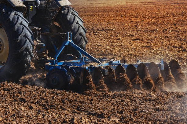istock Agriculture,tractor preparing land 1070670616
