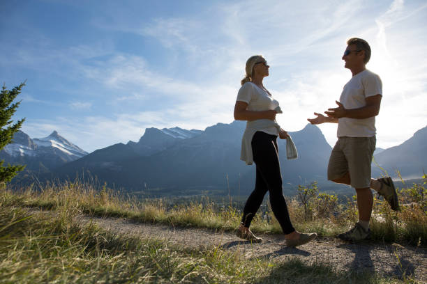 istock Couple follow path in mountains 1070673824