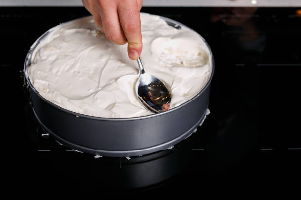 istock Chef making shapes in the sout cream topping 1070674868