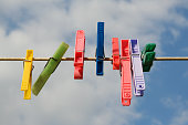 Coloured pegs on a washing line