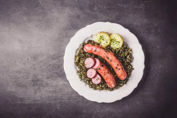 Kale with cooked sausage and potatoes