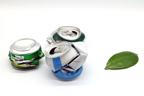 istock aluminum beer can and green leaf on a light background, ecology theme 1070680342