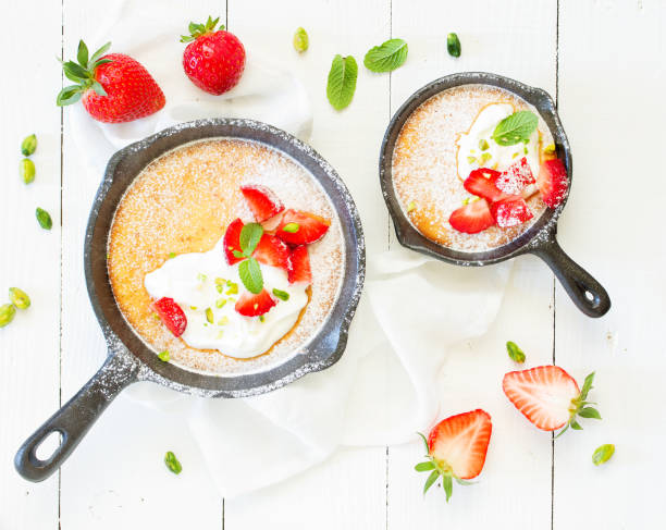 istock almond pie with cream and strawberries. View from above. 1070680880
