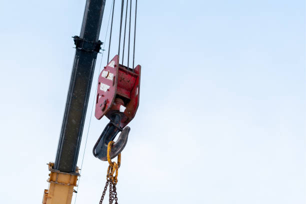 istock Hook of a construction crane against a blue sky. 1070682176