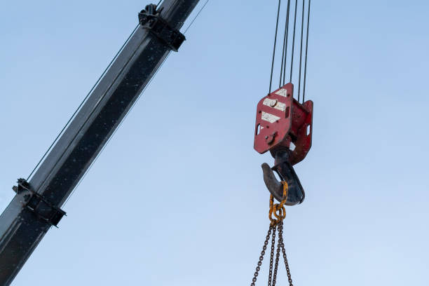 istock Hook of a construction crane against a blue sky. 1070682192